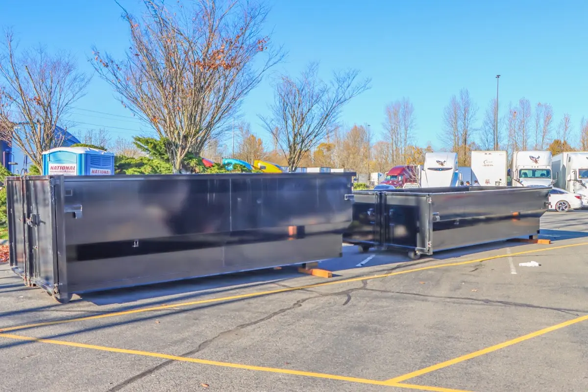 Professional dumpster rental service with roll-off container on residential driveway in Lake Norman of Iredell